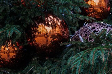 Fototapeta na wymiar Photo of some Christmas decorations in the Christmas tree. Winter, bright colours, joy