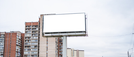 Big billboard on the background of houses - obrazy, fototapety, plakaty