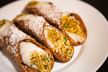 Cannoli are Italian pastries consisting of tube-shaped shells of fried pastry dough, filled with a...