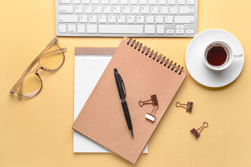 Notebooks with pen on color background