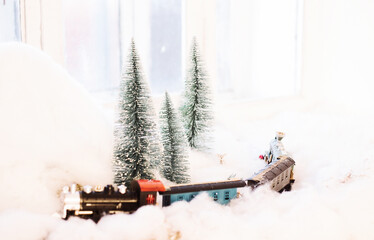 Snow-covered Christmas toy train. Christmas toys. Christmas decor