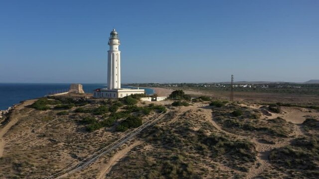 Aerial views of the Trafalgar cape and lighthouse seen from above with marvelous long Andalusian sand beach