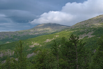 Northern Ural Mountains, Clouds above the spurs of Konzhakovsky Rock Mount and Serebryansky Rock Mount, Russia
