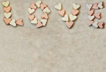 the word love from white and pink marshmallows Valentine's day