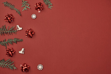 New Year's, festive decor on a red background. Copy space, flat lay, mock up, top view.