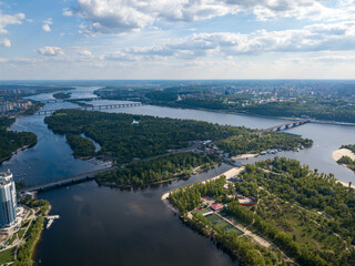 Fototapeta na wymiar Aerial drone view. Automobile bridge over the Dnieper river in Kiev.