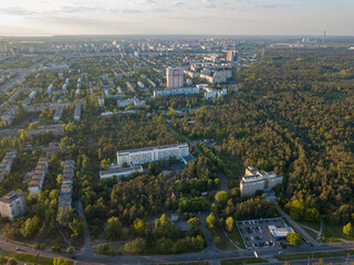 Aerial drone view. Buildings on the outskirts of the city on a sunny summer day.