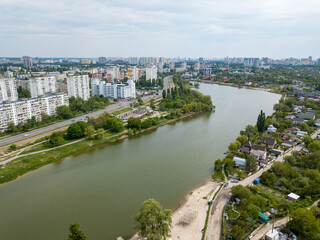 Fototapeta premium Aerial drone view. River bank on a sunny day.