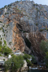 Beautiful view of the Dervish House under the rock in Blagaj. Bosnia and Herzegovina