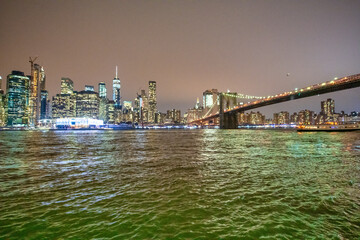 NEW YORK CITY - DECEMBER 6, 2018: Lower Manhattan skyline and Brooklyn Bridge at night