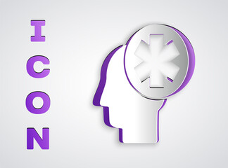 Paper cut Male head with hospital icon isolated on grey background. Head with mental health, healthcare and medical sign. Paper art style. Vector Illustration.