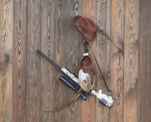 sniper hunting rifle on a wooden wall