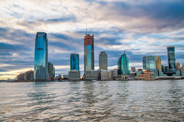 Sunset view of Jersey City from ferry boat