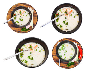 set of sour and spicy soup Tom yam nam khon made with shrimps, coconut milk, chilli pepper, lemongrass, galangal, coriander, kaffir lime leaves in bowl isolated on white background