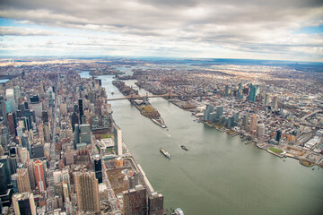 Streets and buildings of Midtown Manhattan and Roosevelt Island, aerial view from helicopter