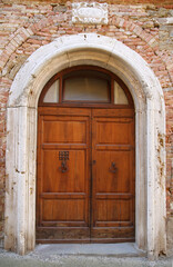 Fototapeta na wymiar Ancient door in the village of Panicale in Umbria, Italy