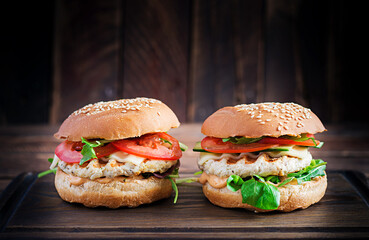 Big sandwich - hamburger burger with turkey meat,  tomato,  cucumber and lettuce.