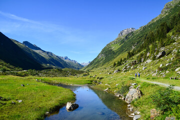 Fototapeta na wymiar Trekking on a summer day in Montafon Valley, Vorarlberg Austria