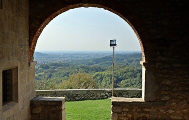 Nimis, Italy.  View of the below valley from the medieval  arch of Ramandolo church, in Friuli, on a summer day