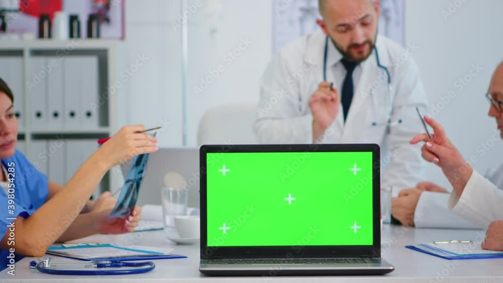 Aufkleber team of doctors with diverse ages brainstorming sitting on desk in hospital meeting office placing l
