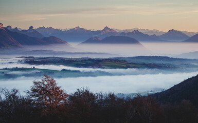 Misty valley view from Mount Salève in autumn, France