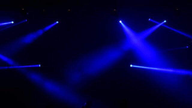 Stage colorful lighting beams spotlight and smoke of events show or concerts