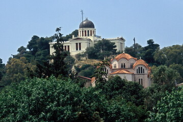 Fototapeta na wymiar View of National Observatory of Athens and orthodox Church Agia Marina on the Hill of Nymphs in Athens, Greece.
