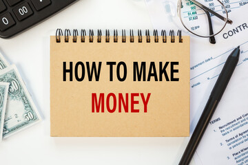 How to make money is written on a notepad on office desk