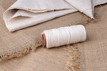 White cord and burlap fabric for sewing and DIY products.