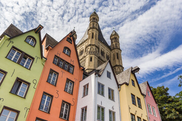 Colorful old houses and church tower at the fish market square in Koln, Germany
