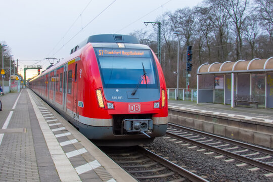 Deutsche Bahn Suburban train stopping at platform Zeppelinheim. Germany, Frankfurt am Main. 14 December 2019.