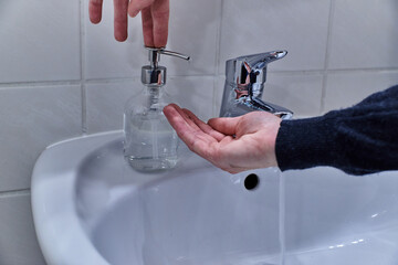 Close up of a person washing hands. Person washing their hands with soap.