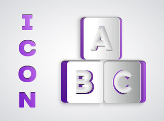 Paper cut ABC blocks icon isolated on grey background. Alphabet cubes with letters A,B,C. Paper art style. Vector.