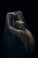 Sea wave. Graceful classic ballet male dancer isolated on white studio background. Man in...