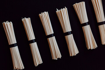 japanese udon noodles isolated on a black background