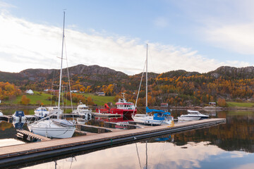 Fototapeta na wymiar Coastal Norwegian landscape with moored yachts