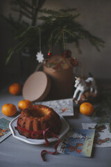 Cupcake, fir branches, Christmas toys on the table.