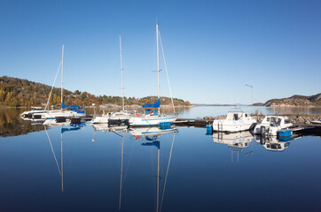 Fototapeta na wymiar Norwegian landscape with small boats and yachts