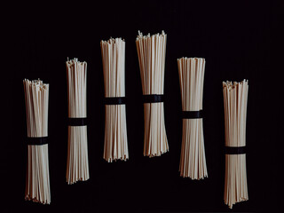 japanese udon noodles isolated on a black background