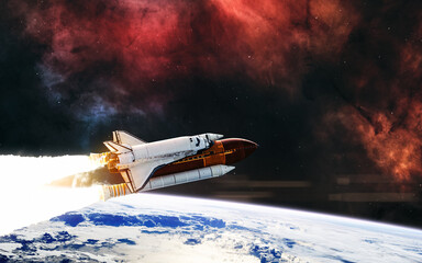 Space shuttle orbiting planet Earth. Science fiction. Elements of this image furnished by NASA