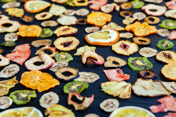 Organic Healthy Assorted Dried Fruit Mix close up. Dried fruit snacks. dried apples, mango, feijoa, dried apricots, prunes top view