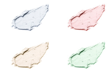 Smears of cosmetic clay isolated on a white background.