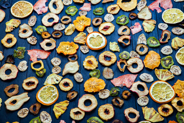 Organic Healthy Assorted Dried Fruit Mix close up. Dried fruit snacks. dried apples, mango, feijoa, dried apricots, prunes top view