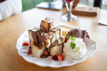 Toast with chocolate ice cream on a white plate