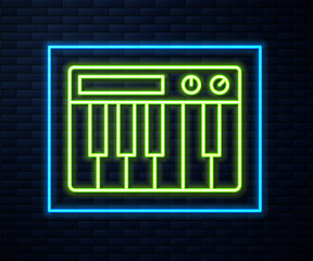 Glowing neon line Music synthesizer icon isolated on brick wall background. Electronic piano. Vector.