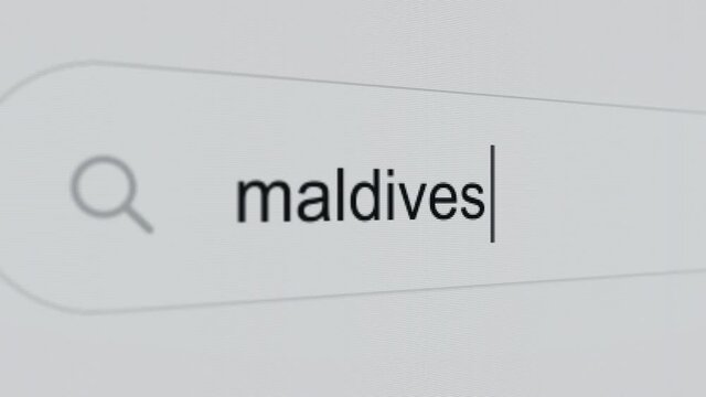 Maldives - Internet browser search bar typing destination text with camera movement.