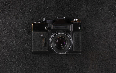 old vintage black camera on black background