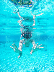 child swimming in the pool