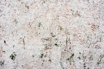 Texture of a concrete wall with cracks and scratches which can be used as a background