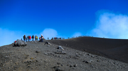 People on excursion on mount Etna, Sicily, Italy
